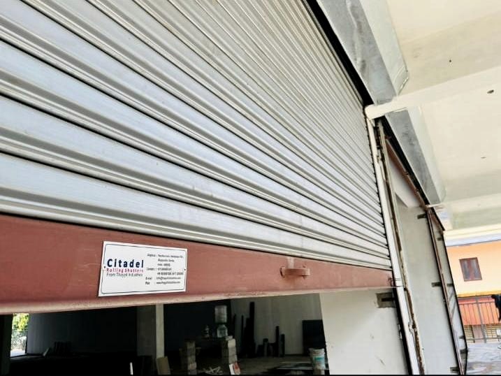 Citadel rolling shutters with the Citadel nameplate, installed at a commercial building